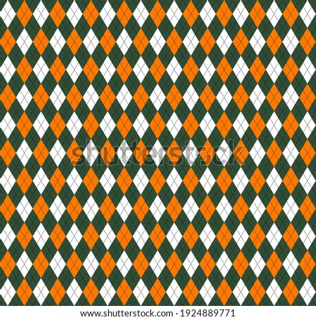 St. Patricks day Argyle plaid. Scottish pattern in green, orange and white rhombuses. Scottish cage. Traditional Scottish background of diamonds. Seamless fabric texture. Vector illustration