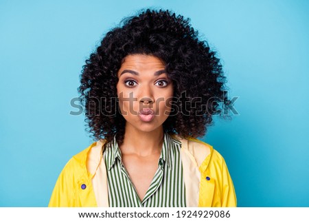 Portrait of adorable curly hairstyle dark skin person kiss lips look camera isolated on blue color background