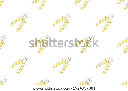 Pliers seamless pattern. Metal pliers with rubber striped grips. Background made of tools. 