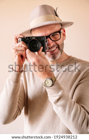 45 year old man with modern digital camera