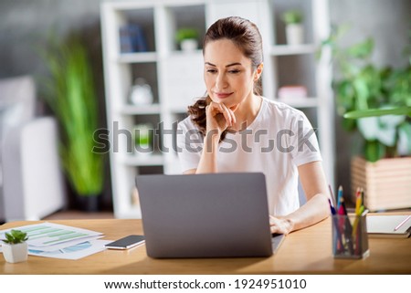 Photo of young beautiful lovely busy focused concentrated remote working in laptop thinking about new project at home house