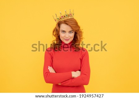 happy redhead woman in crown. self confident queen. expressing smug. arrogant princess in tiara. proud woman smiling. egoistic girl wear diadem. arrogance and selfishness. portrait of glory. Royalty-Free Stock Photo #1924957427