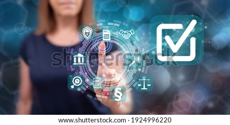 Woman touching a validation concept on a touch screen with her finger Royalty-Free Stock Photo #1924996220