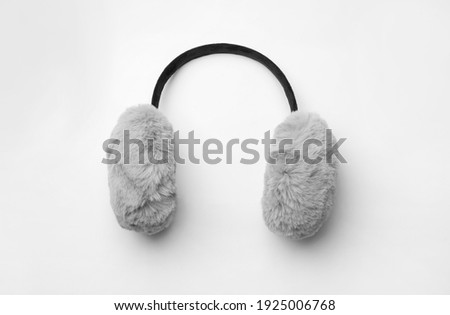 Stylish winter earmuffs on white background, top view Royalty-Free Stock Photo #1925006768