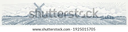 Rural landscape panoramic format with a Windmill and village. Hand drawn Illustration in engraving style. Royalty-Free Stock Photo #1925015705