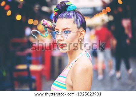 Young cool woman smiling in city street – Authentic carefree girl with trendy colorful braided hair enjoying weekend vibes outdoor Royalty-Free Stock Photo #1925023901