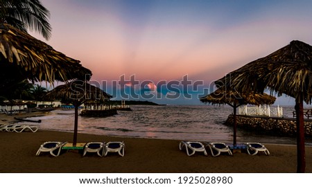 View to the sunrise at runaway bay in Jamaica Royalty-Free Stock Photo #1925028980