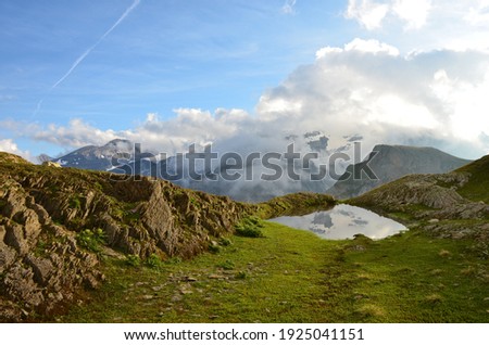 small mountain lake above the limmernsee in the canton of glarus. sunset. Picture near the world famous Limmernsee