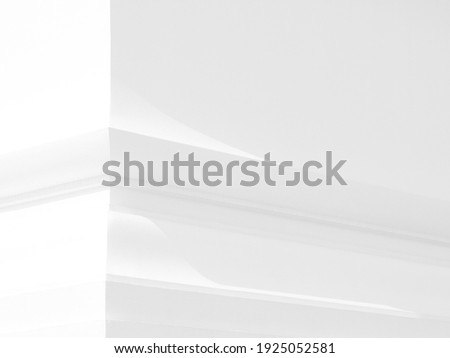 White concrete wall corner with light and shadow