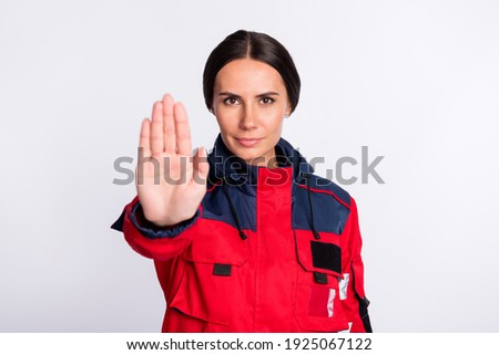 Portrait of beautiful trendy strict girl medic doc showing stop palm sign isolated over grey pastel color background
