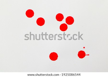 drops of water clolor-red in white background.