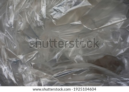Plastic background. White plastic bag texture, macro. Copy space. Royalty-Free Stock Photo #1925104604