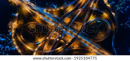 Aerial view of transportation with Expressway, Road and Roundabout, multilevel junction traffic highway-Top view. Important infrastructure and transport in big city, Bangkok Thailand. Royalty-Free Stock Photo #1925104775
