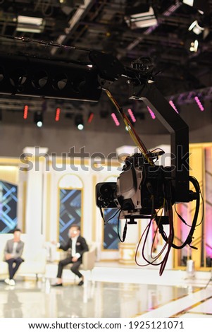 Crane with a high quality camera of television broadcasting and movie production. Royalty-Free Stock Photo #1925121071