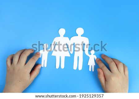 Baby's hands support Paper family