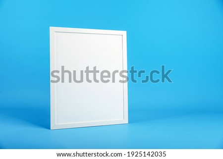 white square frame with mock up on blue background with copy space.