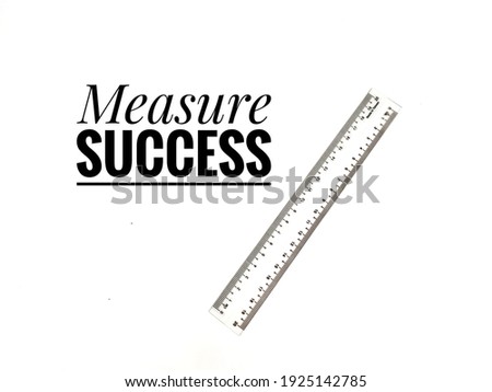 'Measure Success' quote with a ruler isolated on white background. Minimalist concept.