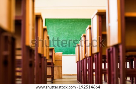 Path between desks in a classroom Royalty-Free Stock Photo #192514664