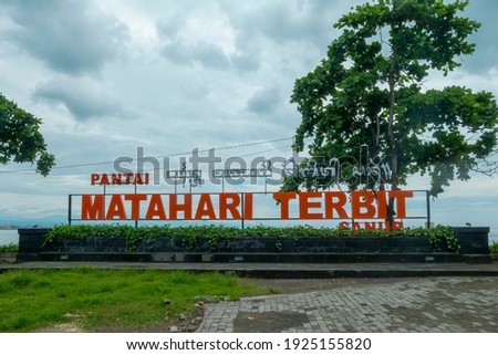 The entrance to Sanur beach with a sign that reads "Pantai Matahari Terbit" or Sunrise Beach