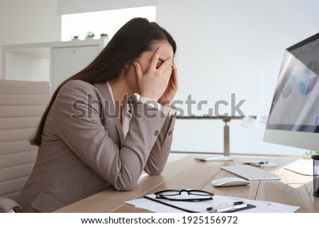 Businesswoman stressing out at workplace in office