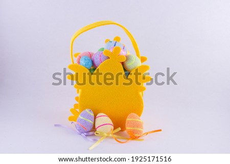 Kids Easter Chick Bag full of bright coloured eggs on white
