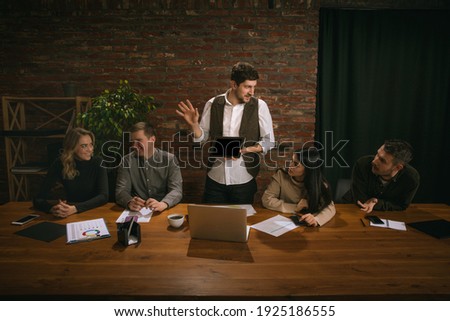 Young people at office meeting in classical painting in renaissance style.