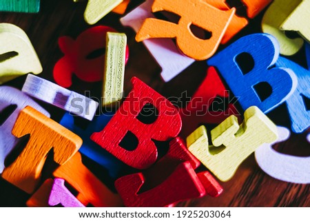 Colorful wooden letters background - Colors and shapes letters