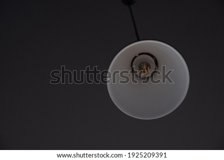 Black lamp with a white inside 