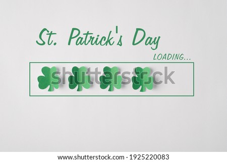 Close up photo image of green clover leaves in a line with text st. patrick's day loading isolated white color backdrop