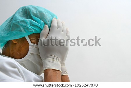 doctor with face mask and white gloves in hospital with white background stock photo