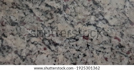 Granite pattern or texture, with random natural patterns consisting mainly of grey and black elements