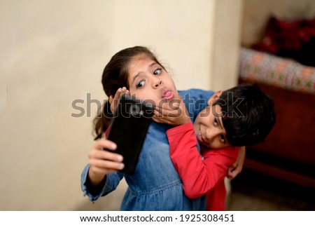 little friend taking selfie with smartphone Royalty-Free Stock Photo #1925308451