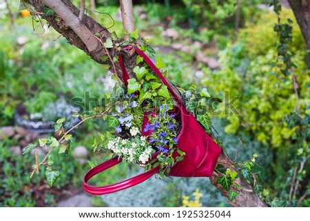 Garden fashion for a flower planter from upcycled clothes