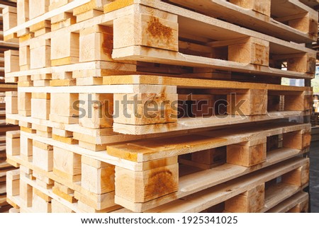 The pallets are located in the middle of the warehouse