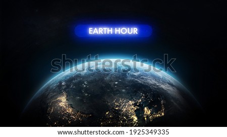 Electric Hour event near Earth planet. Earth day theme. Protection of environment. Elements of this image furnished by NASA
