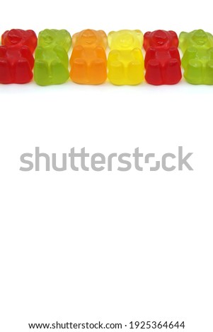 Colourful gummy bears candies isolated on white background. Fun candy macro shot. Copy space for your text.