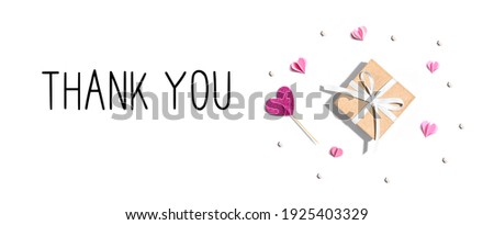 Thank you message with a small gift box and paper hearts