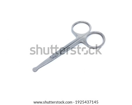 A picture of mini scissors in a white background