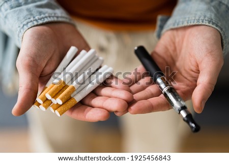 Smoking Tobacco E Cigarette. Holding Tobacco Vape Royalty-Free Stock Photo #1925456843