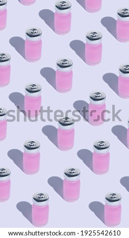Seamless pattern with close up of flu vaccine bottles on bright background. Minimal coronavirus infection novel virus disease layout. Vaccination or preventive treatment of flu. Flat lay.