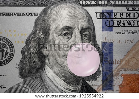 The value of the US Dollar: Benjamin Franklin blowing bubblegum, Ideas for US stock market bubble, Stockmarket overvalued, Economic bubbles, Financial panic or crisis, Monetary liquidity Royalty-Free Stock Photo #1925554922