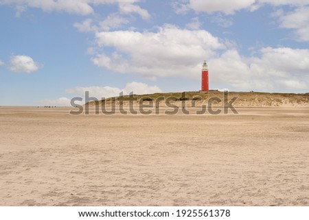 Sandy beach and lighthouse called "Eierland" on the wadden island of Texel, the Netherlands Royalty-Free Stock Photo #1925561378