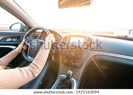 Driver car. Fun drive in winter vacation ride day. Happy young woman have road travel trip inside car in sunny day