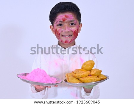 Small kid in Holi colors on the festival of colors 