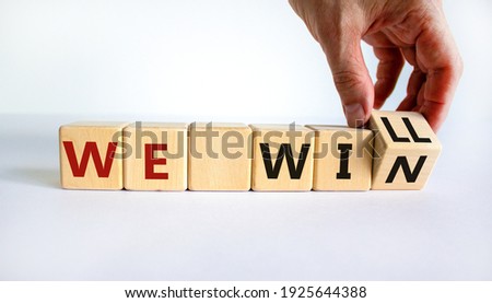 We will win symbol. Businessman turns cubes and changes words we will to we win. Beautiful white background, copy space. Business, motivational and we will win concept. Royalty-Free Stock Photo #1925644388