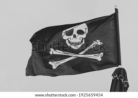 Pirate flag, black and white skull and bones, Jolly Roger.