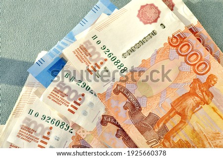 
Photo of money, bills, banknotes. The money is red, five thousand