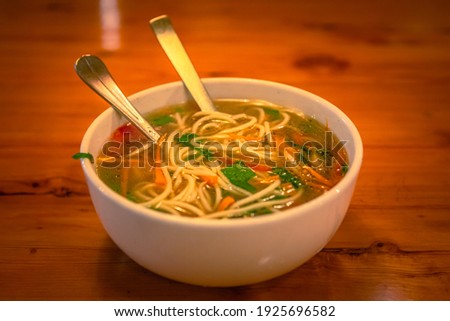 Selective focus of Thukpa, It is a Tibetan noodle soup, which originated in the eastern part of Tibet. Royalty-Free Stock Photo #1925696582