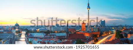 Skyline Of Berlin in Germany with TV Tower, Berlin Town Hall and a busy street in the evening Royalty-Free Stock Photo #1925701655