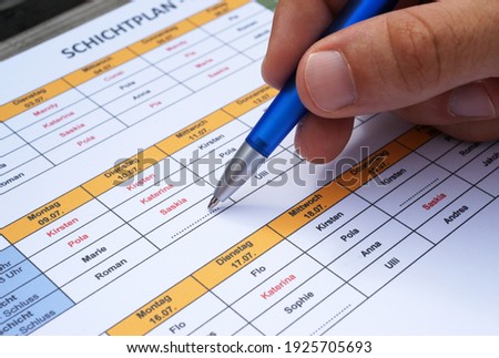Personnel staff planning to devide personnel in shift schedule by hand and pen Royalty-Free Stock Photo #1925705693